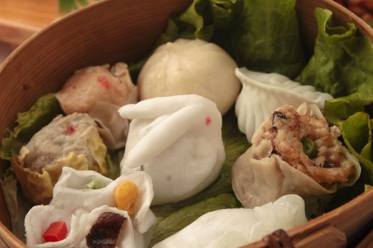 wontons in wooden bowl