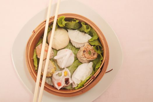 wontons in wooden bowl