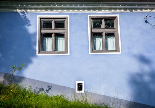 Viscri, Romania - June 23, 2013: Blue painted traditional house from Viscri village in Transylvania, Romania