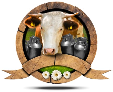 Wooden symbol with head of cow, cans for the transport of milk, green grass and three daisy flowers. Wooden empty ribbon for your text. Isolated on white
