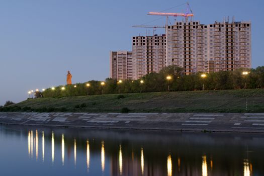 Evening view of the residential complex under construction high-rise buildings on the waterfront of Krasnoarmeysk district of Volgograd