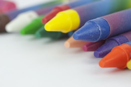 Close up of different coloured crayons