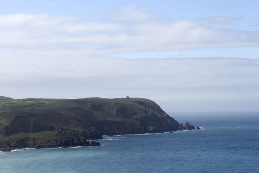 A neck of land with the ocean and sky in between