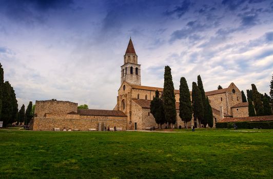 View of Basilica di Santa Maria Assunta and bell tower of Aquileia, Italy. Aquileia is UNESCO World Heritage Site