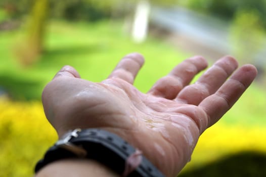 Hand under the rain
