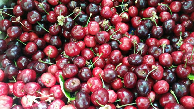 Red cherries background - Saint-Antoine market in Lyon, France