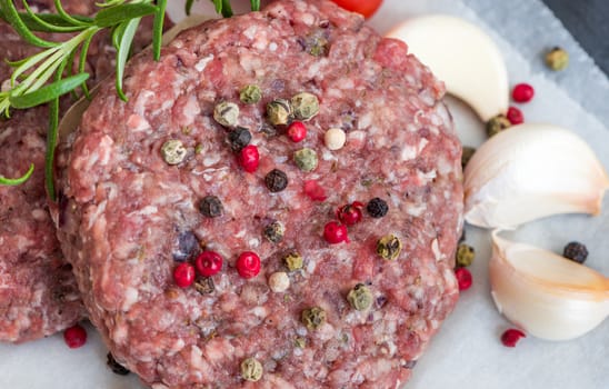 Raw Minced Hamburger Meat with Herb, Spice and Garlic Prepared for Grilling