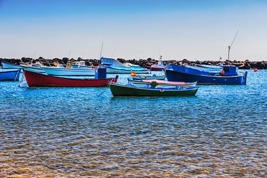 Boats on the water with waves in harbor or port