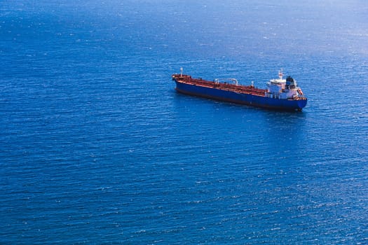 Aerial view to empty container cargo ship in sea