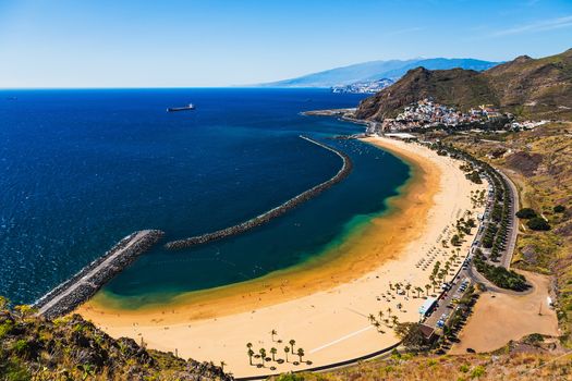 Aerial view to beach or playa Las Teresitas in Santa Cruz on coast of the Atlantic ocean on Tenerife Canary island, Spain at spring or summer