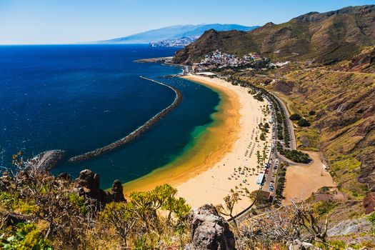 View from mountain to beach or playa Las Teresitas in Santa Cruz on coast of the Atlantic ocean on Tenerife Canary island, Spain at spring or summer