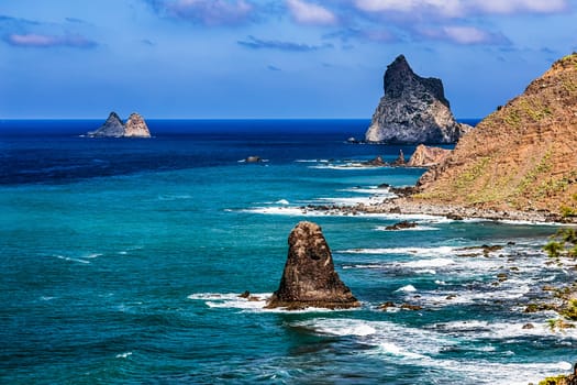 Stone coast or shore with rock of Atlantic ocean and sky with clouds and skyline or horizon landscape in Tenerife Canary island, Spain