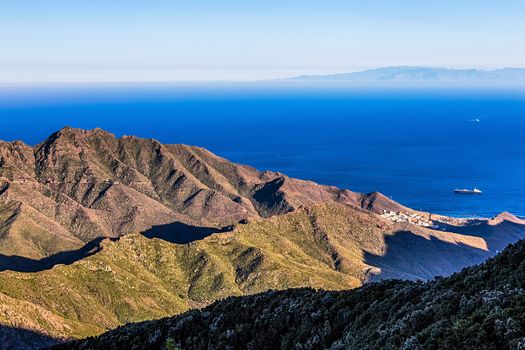 View to ocean or sea with ship from above from rock or mountain with island on background