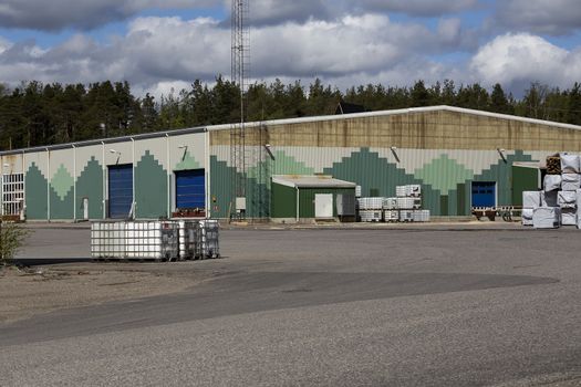 An industry area with some storage buildings and some stuff outside