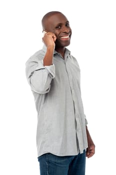 Sideways of  handsome man talking on cell phone