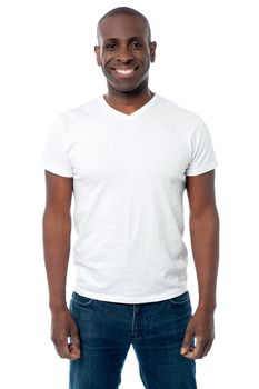 Image of a relaxed man posing over white