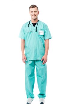 Full length of male doctor posing over white