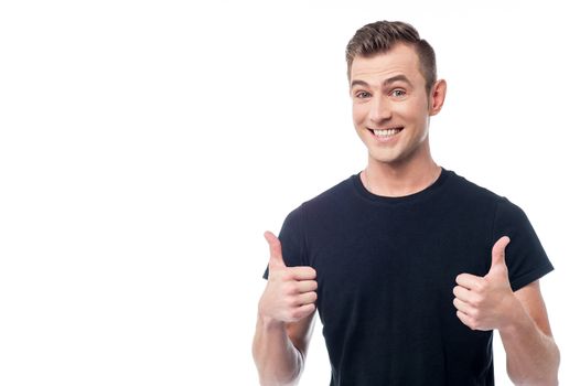 Smiling man showing double thumbs up gesture