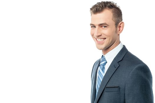 Side pose of cheerful businessman over white