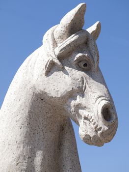 A stone carving of a horse outside a Chinese restaurant in Cleveland, Ohio.   It is part of a collection of animal statues representing signs of the Chinese zodiac







A carving in stone of a horse head in front of a Chinese restaurant in the Asian section of Cleveland, Ohio.  It is part of a collection of animals representing the Chinese zodiak