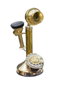 Antique golden brass telephone isolated on white background