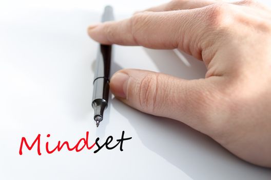 Pen in the hand isolated over white background Mindset