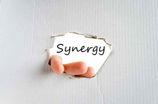 Hand and text on the cardboard background Synergy