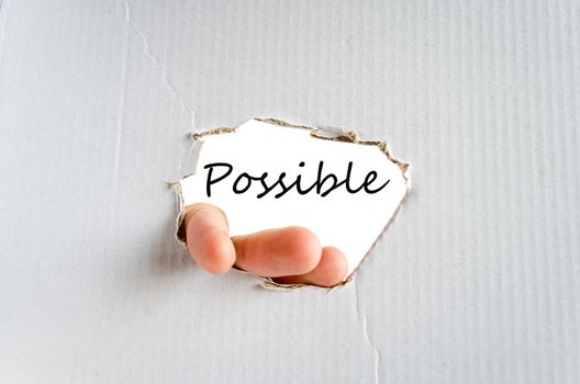 Hand and text on the cardboard background Possible