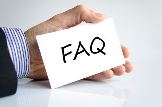 Faq note in business man hand