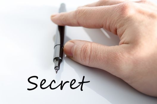 Pen in the hand isolated over white background Secret