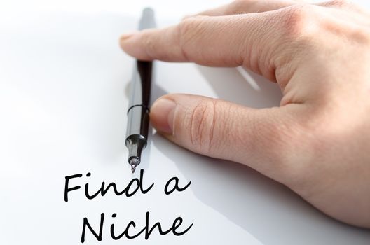 Pen in the hand isolated over white background Find a Niche Concept