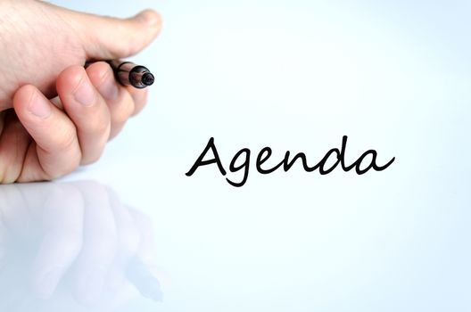 Pen in the hand isolated over white background Agenda concept