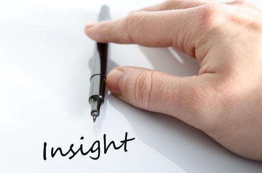 Pen in the hand isolated over white background Insight Concept