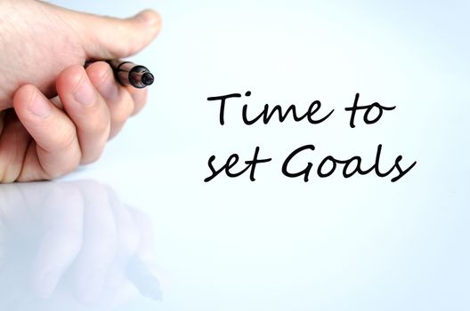 Pen in the hand isolated over white background Time to set goals concept