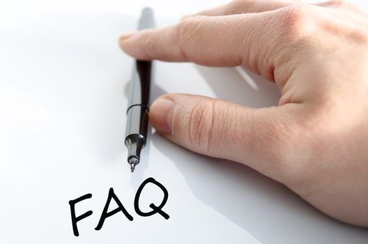 Pen in the hand isolated over white background Faq Concept