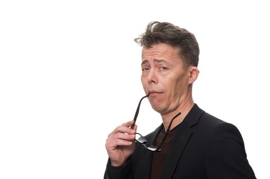 Close up Middle Age Businessman, Holding his Eyeglasses, Showing Dismissive Shrug While Looking at the Camera. Isolated on White Background.