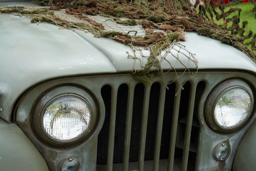  U.S. Army Jeep Front Detail  with combat green camouflage net                               