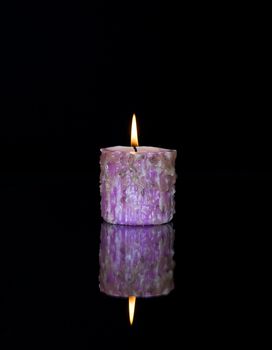 Candle light on the black background.