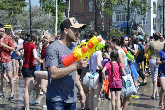 The game "Water Fight" in honor of opening of a summer season on the street in Tyumen. 31.05.2015