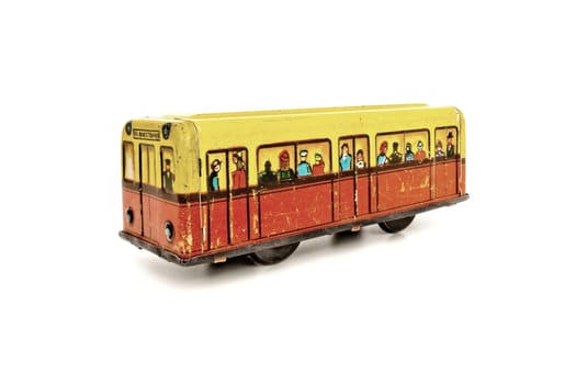 Wagon of subway  is powered by clockwork.  It  is old tin toy from Russia.