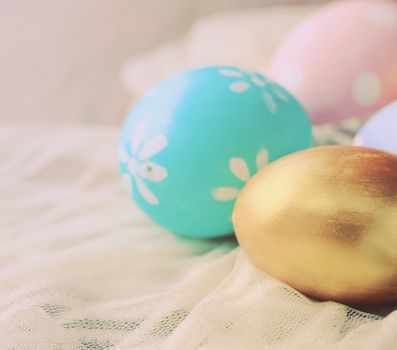 Pastel easter eggs on cloth with retro filter effect