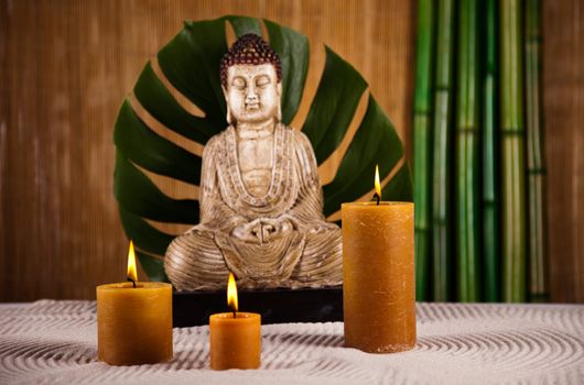 Buddha statue with orchid flower