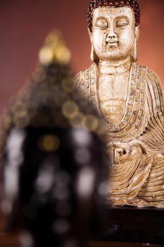 Buddha statue with orchid flower