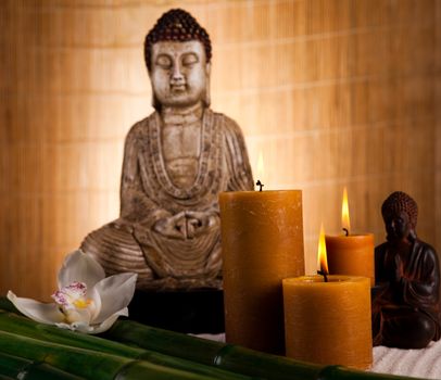 Buddha statue with orchid flower