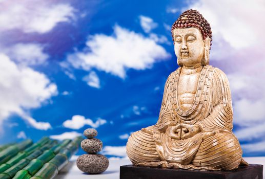 Buddha statue with orchid flower