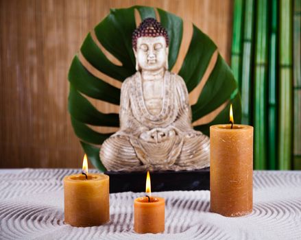 Buddha statue with orchid flower