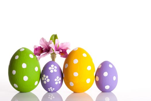 Hand painted Easter eggs and flower isolated on white background.