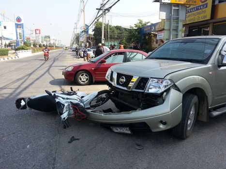 CHIANGMAI, THAILAND-JANUARY 10, 2013: Crash Accident Pickup Truck with Motorcycle at roadside in Chaingmai, Northern Thailand.