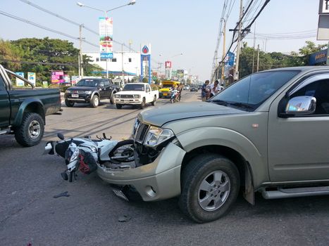 CHIANGMAI, THAILAND-JANUARY 10, 2013: Crash Accident Pickup Truck with Motorcycle at roadside in Chaingmai, Northern Thailand.