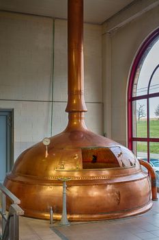 Traditional copper distillery tanks in a beer brewery